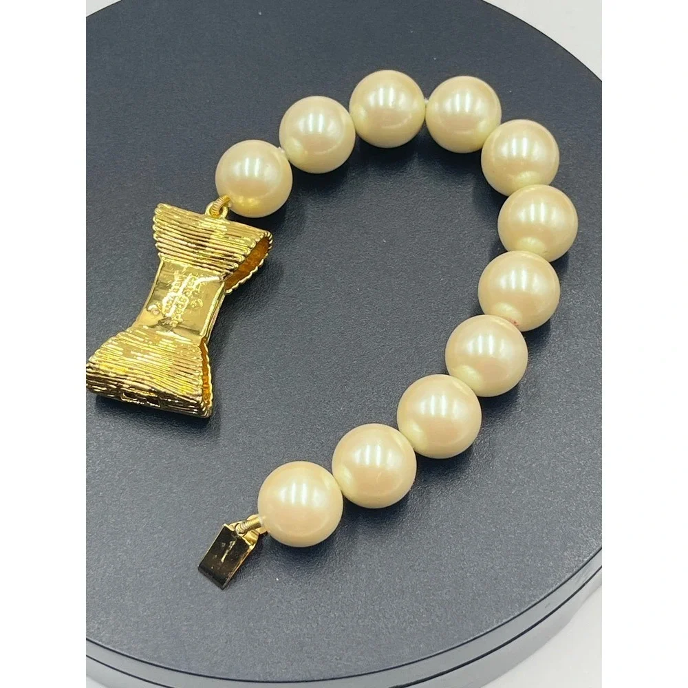 Kate Spade All Wrapped Up Pearl Gold Bow Bracelet‎